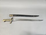 pair of antique swords on a white surface
