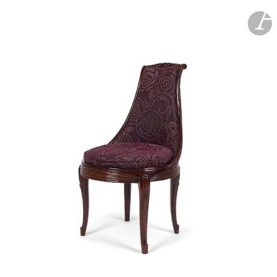 the chair is made of wood and has a purple upholstered upholstered seat
