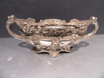 a silver bowl that is sitting on a table