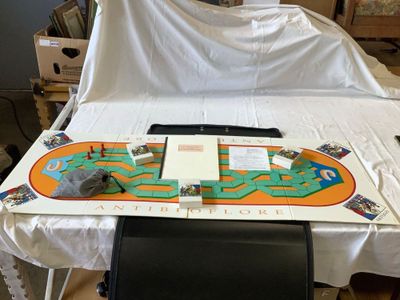 a table with a board on it and a chair in front of it