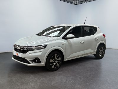 the white car is parked in a large room with a black floor
