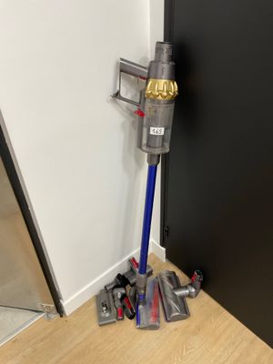 a vacuum that is sitting on the floor next to a door