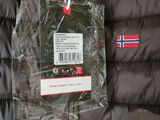 a jacket with a tag attached to it on a hanger