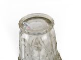 a glass jar with a lid on a white surface