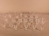 a lot of empty wine glasses sitting on a table