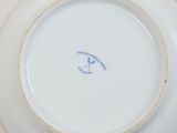 a white plate with a blue and white design on it