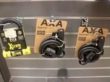 two pairs of headphones hanging on the wall