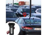 many cars parked in a parking lot with a red marker