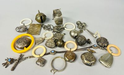a pile of assorted silver items on a table