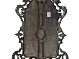 a large ornate mirror hanging on the wall