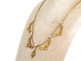 a close up of a necklace on a mannequin mannequin