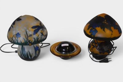three lamps that are sitting next to each other on a table