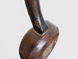 an image of a close up of a wooden object on a white surface