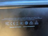 a close up of a black laptop computer with a blue screen