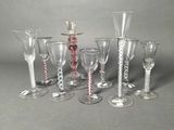 a group of wine glasses sitting next to each other on a table