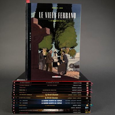 books stacked on top of each other on a gray surface