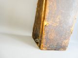 an old suitcase that is sitting on a white surface