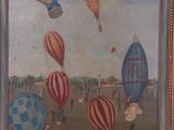 painting of a group of hot air balloons flying in the sky