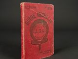 a red book with a picture of a woman ' s name on it