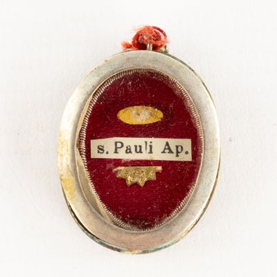 a silver locke with a picture of a man on it