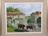 two cows standing in the water next to a building