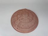 une image représentant un biscuit au chocolat posé sur une surface blanche