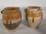 two vases sitting side by side on a table