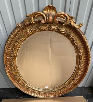 an image of a gold mirror sitting on top of a cardboard box