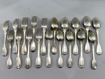 a lot of silver spoons and forks on the table