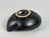 an image of a black vase with a gold ring on it