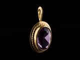 a gold pendant with an amethorate stone in the center