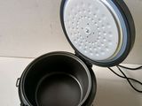 a pot that is sitting on a counter next to a bucket