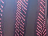 a close up of a curtain with a pattern on it