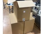 three boxes stacked on top of each other in a room