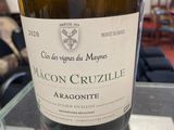 a bottle of wine that is sitting on a table