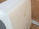 a white toaster sitting on the floor next to a brown wall