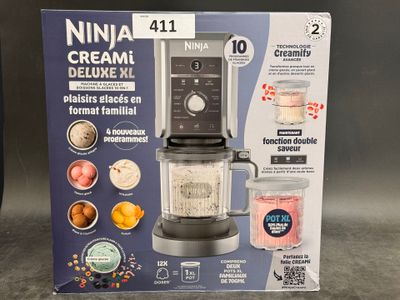 packaging of a black and silver blender sitting on top of a counter
