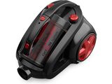 un gros plan d'un aspirateur noir et rouge posé sur une surface blanche