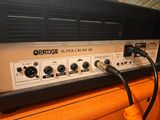 an orange and black guitar amplifier sitting on top of an orange cabinet