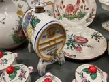 many plates and cups that are on a table