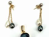 pair of black and white pearl earrings with gold chain