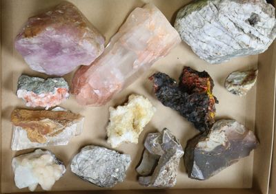 a box full of different types of rocks and stones