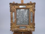 a picture of a mirror on a wooden easel