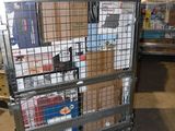a metal cart with many boxes on it in a warehouse