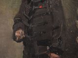 portrait of a man in a military uniform holding a gun
