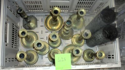 a lot of old brass fire hydrants in a crate