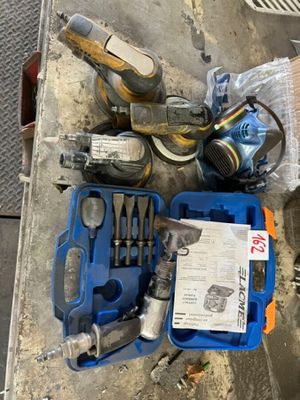 a box of tools sitting on the floor next to a box of tools