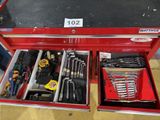 a red tool box with tools in it on the floor