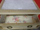 a small table with a marble top on it