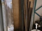 an image of a bathroom with a toilet and a bucket